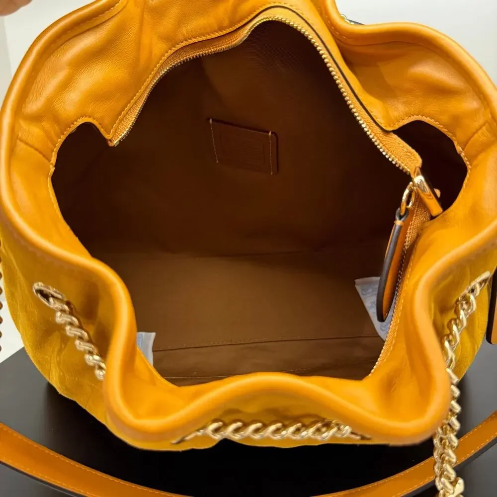NEW‼️Coach Evelyn Shoulder Bag With Quilting And Charm CET33 suede/Gold/Marigold
